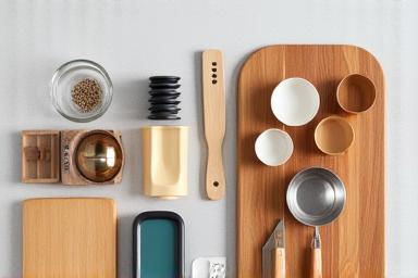 Variety of kitchen accessories including measuring cups and cutting boards.
