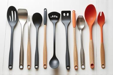 Collection of assorted metal and silicone kitchen utensils.